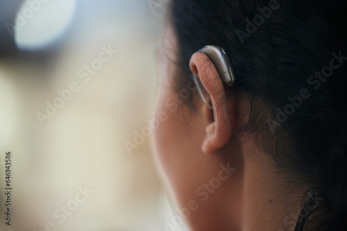 Hearing aid, closeup and ear with a person with a disability for helping with audio and medical implant. Technology, patient and healthcare problem with listening support and wellness tool with back
