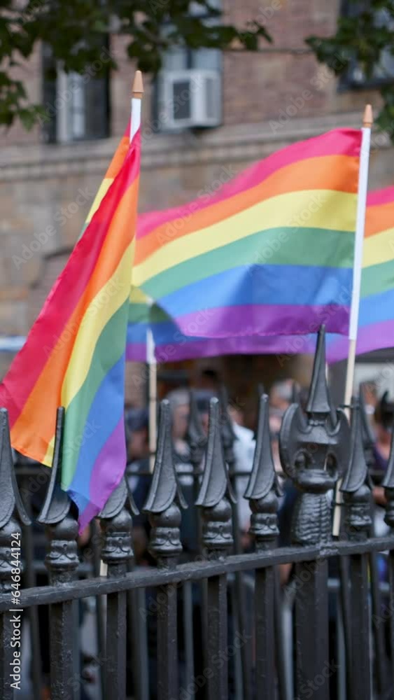 Rainbow flags on fence in a park, LGBTQ event in Greenwich village, NYC, vertical short video Rainbow flags on fence in a park, LGBTQ event in Greenwich village, NYC, vertical short video