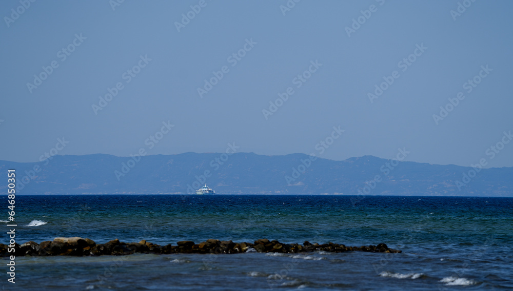 boat with tourists in the vicinity of the island of Thassos. landscape.