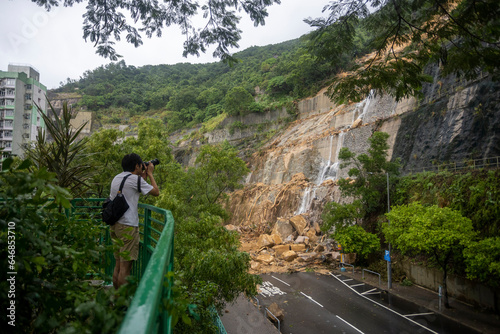 2023 Sept 9,Hong Kong.Landslide scene after heavy rain, with mud blocking the entire road , Yiu Hing Road, Yiu Tung Estate, Shau Kei Wan. photo