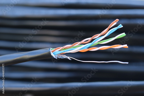 Symmetrical cable. Twisted wires in cable. This cable is used to connect computers to a network.