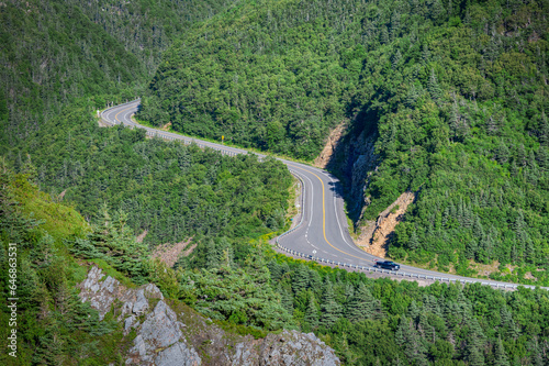 Pickup driving the curves of Cabot trail on the Cape Breton Island, Nova Scotia, Canada
