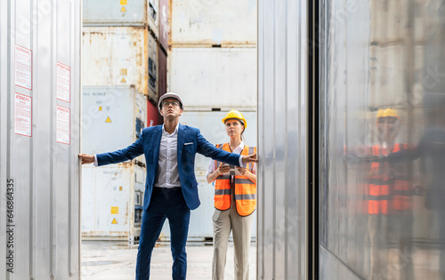 Engineer control loading Containers box from Cargo freight ship,Freight shipping containers at the docks,Large container shipping at shipping yard main transportation of cargo container shipping.