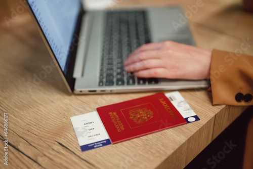 Woman with russian passport is waiting for her flight.