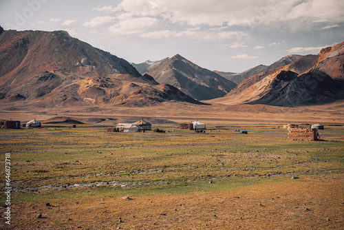 Yurts among the mountain desert at an altitude of more than four thousand meters in the Pamir Mountains. Tajikistan, near the village of Murghab. photo