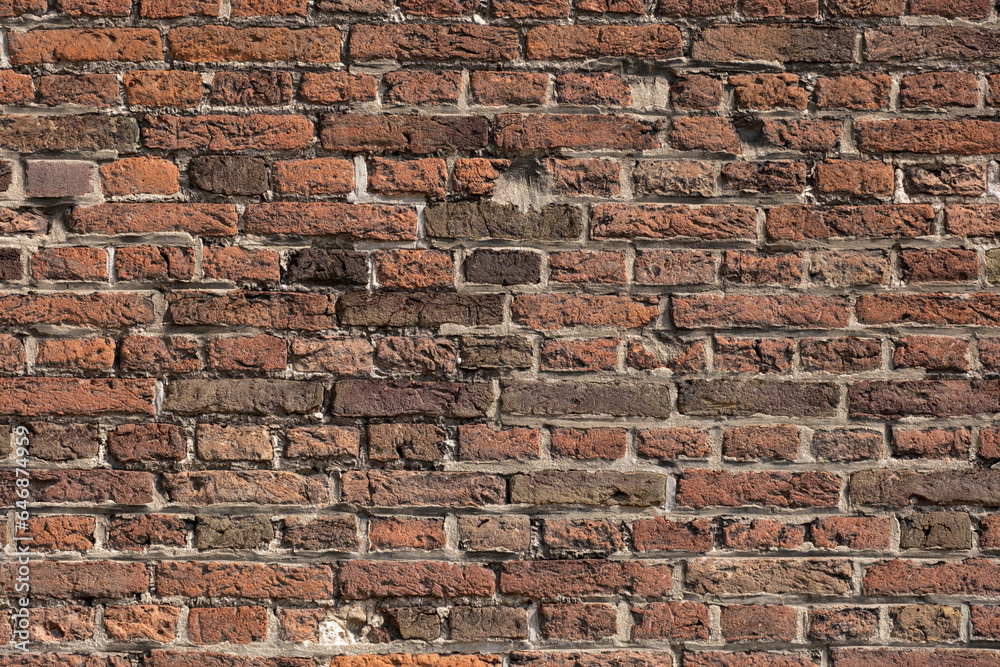 Old stone masonry. Old masonry wall in an abandoned house.Antique natural stone wall. Old stone masonry. Old masonry wall in an abandoned house.Antique natural stone wall.