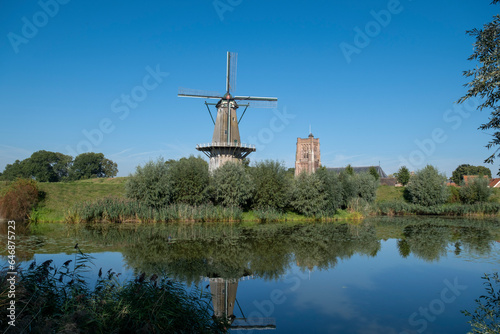 Colorful panoramic view of the Dutch fortress town Woudrichem in the province of Noord-Brabant on a sunny day in the fall season © Tjeerd