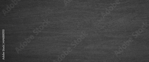 Black, dark and gray abstract cement wall background.chalkboard background