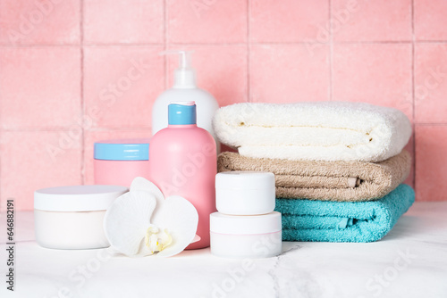 Clean towels and cosmetic products in the bathroom.