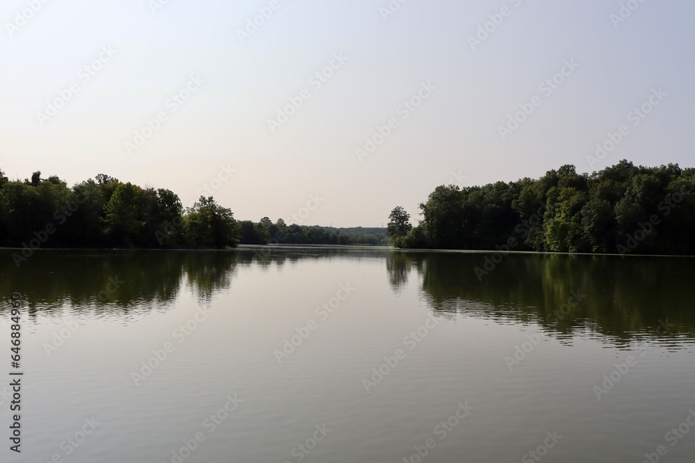 The peaceful lake in the countryside on a clear morning.