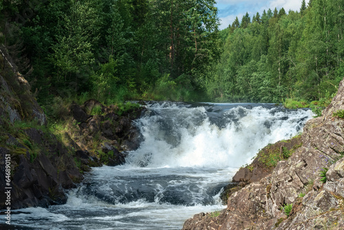 natural landscape with a clear waterfall on a forest river