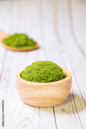 Wolffia globosa in wooden bowl. Wolffia is the nutrient-rich plant-based source of protein and omega3 and vital minerals like zinc  calcium  iron  B12 and so much more.