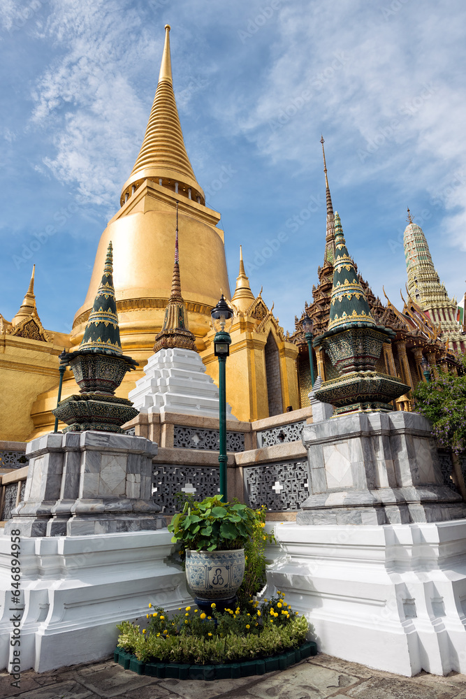 Fototapeta premium Phra Siratana Chedi at Grand Palace in Bangkok, Thailand - This golden, bell-shaped stupa on the upper terrace of Wat Phra Kaew is the tallest structure
