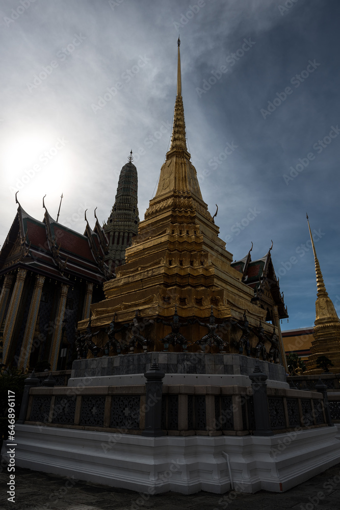 Fototapeta premium Wat Phra Kaew or Emerald Buddha Temple against sunlight in Grand Place, Bangkok, Thailand - Wat Phra Kaew or Emerald Buddha Temple a tourist landmark in Bangkok Thailand