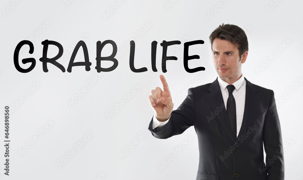 Man touching on a touchscreen with “Grab life Man touching on a touchscreen with “Grab life