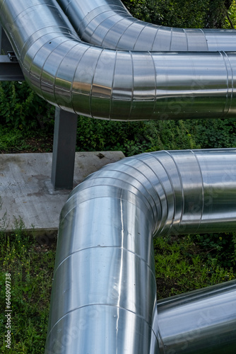 large silver tubes for district heating in sunlight