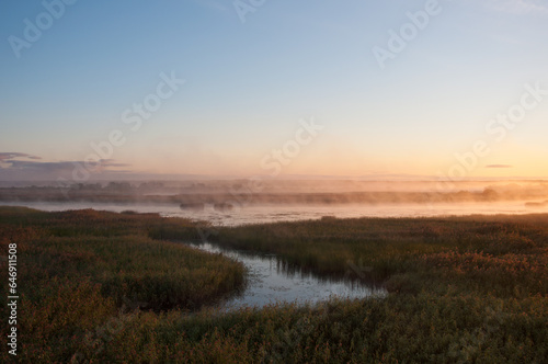 Sunrise and early morning fog in the Kokem  enjoki river delta in Pori  Finland