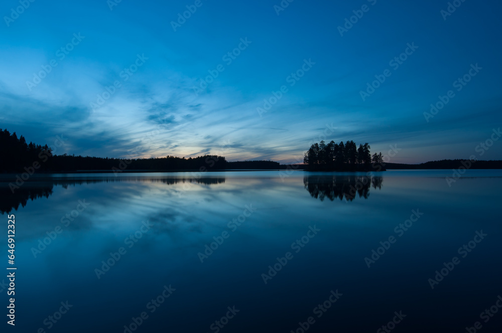 Autumn night scenery in the forests by a lake in Finland