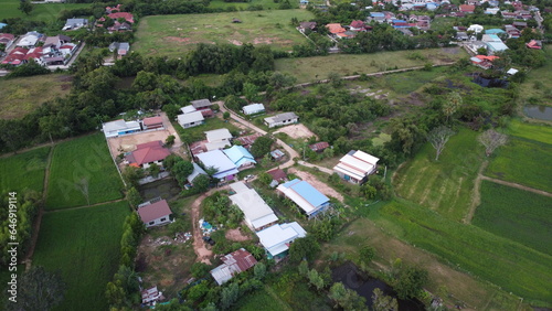 Aerial view of green fields and farmlands in rural Thailand.