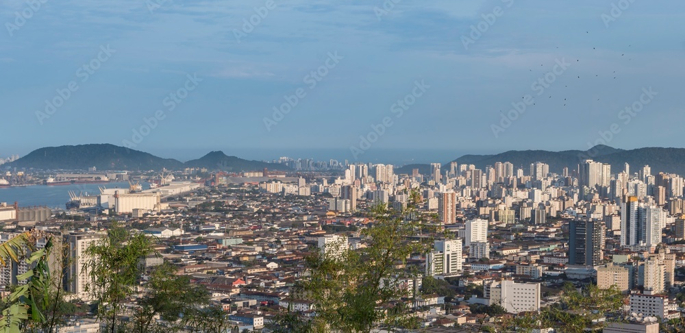 City of Santos, Brazil. panorama of the city and the harbor channel. In the background, the city of Guarujá. View from the top of Serrat Mountain.