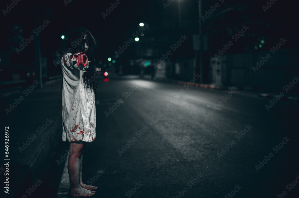 Obraz premium Horror woman concept,Ghost on the road in the city,A vengeful spirit on the street of the town,Halloween festival,Make up ghost face
