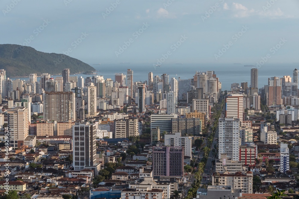 City of Santos, Brazil. Aerial view of the city. Ana Costa avenue on the left  crossing the neighborhoods of Vila Mathias, Campo Grande and Gonzaga. In the background the sea and ships on the horizon.