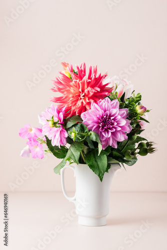 Bouquet of red and pink dahlias. © Nataliia Sirobaba