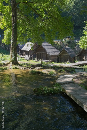 Jaice, Bosnia and Herzegovina - Sep 11, 2023: Mlincici watermills on the Pliva lake in Jaice. Wonderful landscapes in Bosnia and Herzegovina. Sunny day. Selective focus.