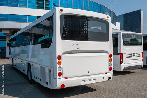 White intercity buses at the bus station on a clear day
