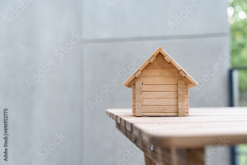 Little toy wooden house with copy space. Own home concept.