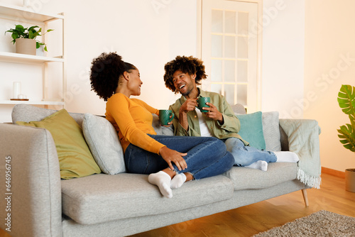 Happy African American Couple Enjoying Relaxing Coffee Break Together Indoors