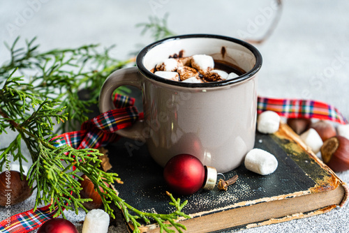 Mug of hot drink on book