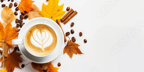 Fototapeta Naklejka Na Ścianę i Meble -  Pumpkin spice latte on a white background with cinnamon sticks and autumn leaves with copy space.