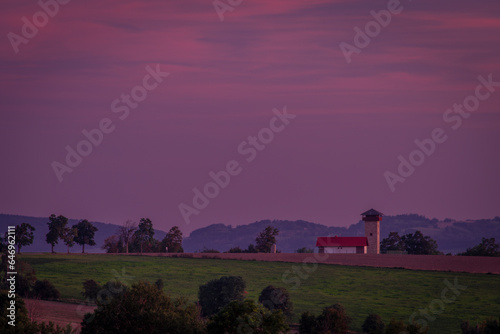 Lookout tower on hill near Roprachtice village in color evening photo