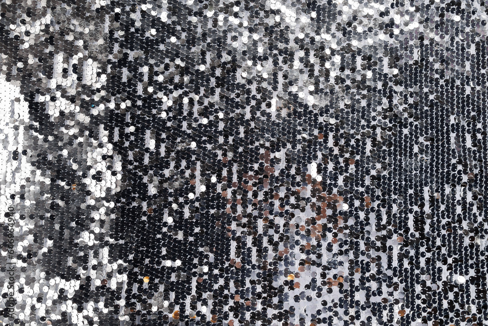 Fototapeta premium Festive gray background of sequins.