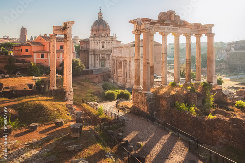 Golden sunrise light over the ancient classical ruins of the historic Roman Forum as seen from Capitoline Hill or Campidoglio in Rome, Italy.