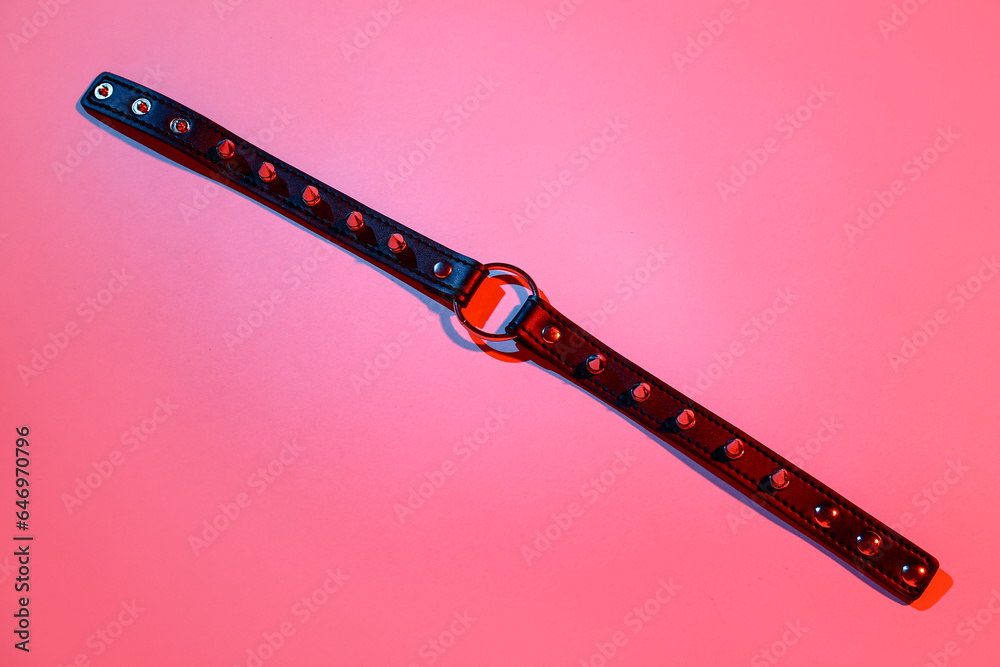 Strap from sex shop on red background Strap from sex shop on red background