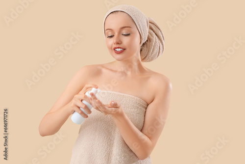 Young woman applying skinca...