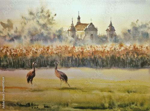 Late summer rural landscape with cranes on a meadow and architecture in background. Tykocin  Poland. Picture created with watercolors.