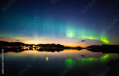 Beautiful aurora with reflections to the ocean