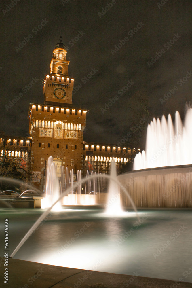 Castello Sforzesco di Milano and its fountain by night 