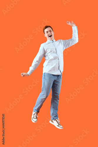 Happy jumping young man on ...