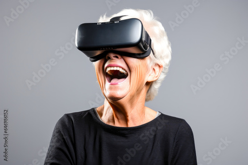 Elderly woman wearing VR headset, expressing wonder and joy. Presenting the excitement of technology and innovation in later life