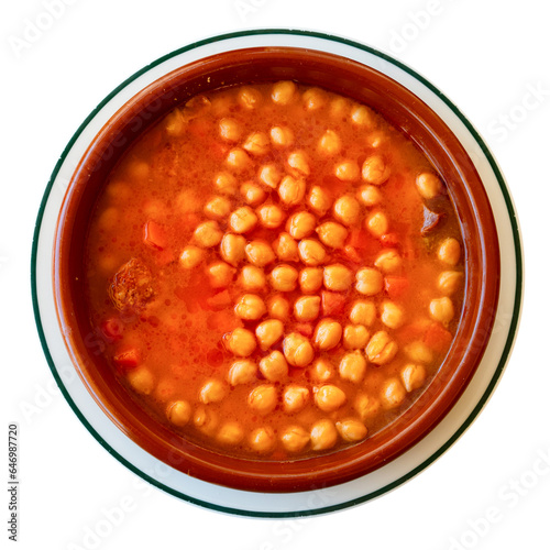 National Spanish dish of Garbanzos a la riojana in a ceramic bowl. Isolated over white background photo