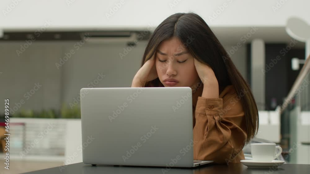 Stressed tired Asian woman female office worker businesswoman chinese korean japanese girl freelance working online with laptop computer in cafe stress business job failure project mistake on website