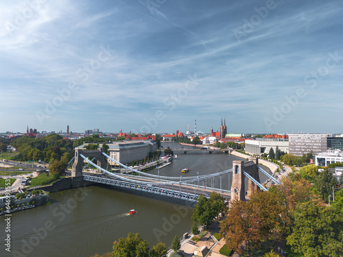 Obraz na płótnie Summer panoramic cityscape of Wrocław, Poland, with a Grunwald Bridge (Most Grunwaldzki) in the foreground w salonie