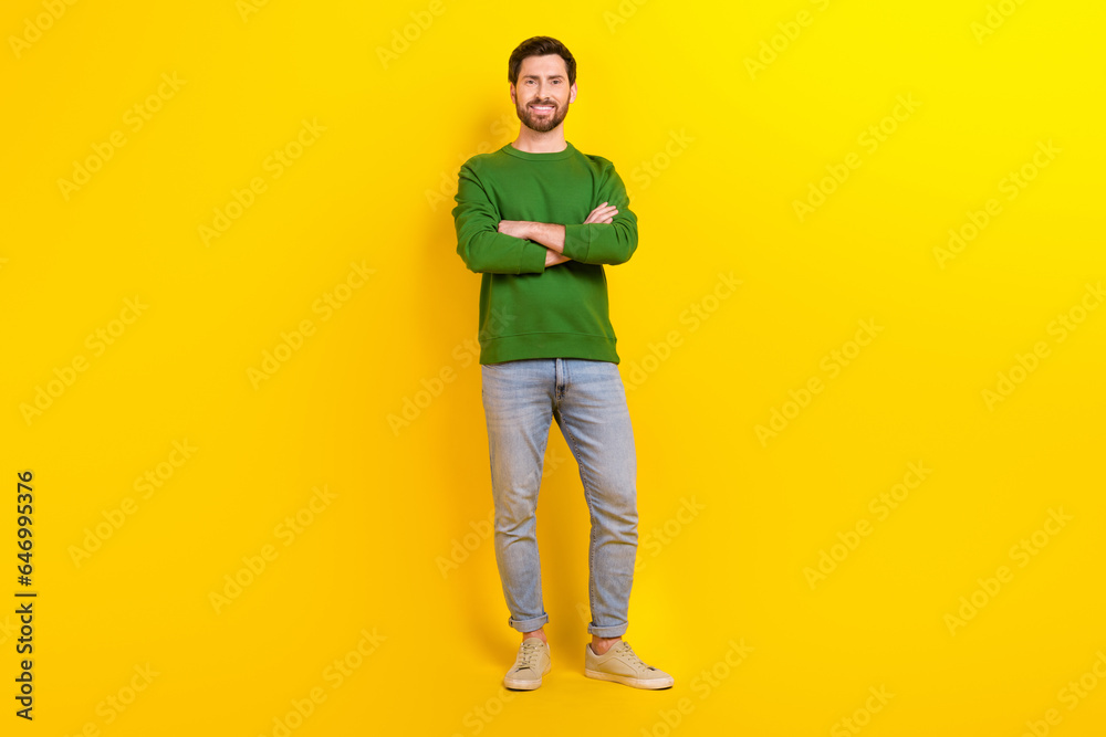 Fototapeta premium Full body size of confident young man leader president director entrepreneur wear smart casual clothes isolated on yellow color background