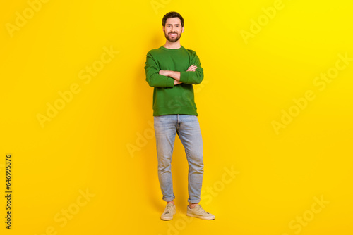 Full body size of confident young man leader president director entrepreneur wear smart casual clothes isolated on yellow color background