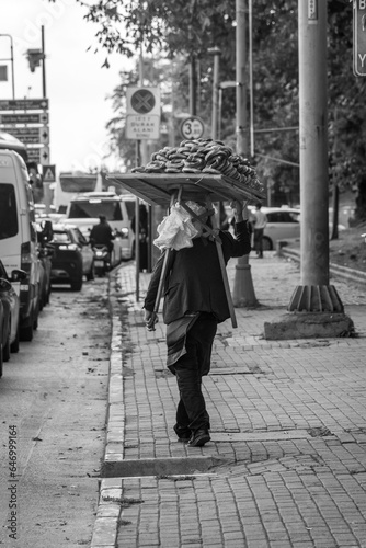 A man selling simit, traditional turkish street food, to cars in traffic jam in Istanbul, Turkey