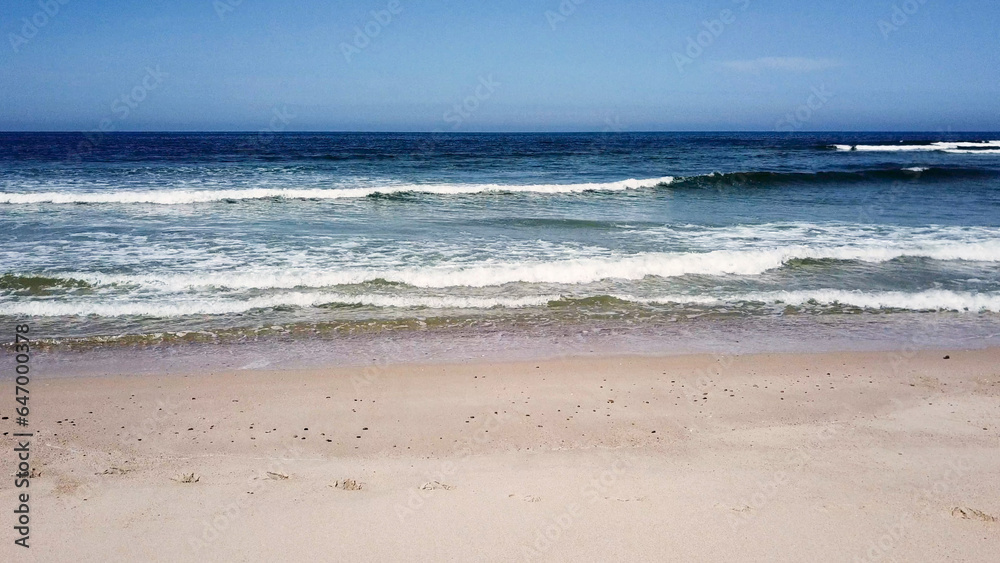 Ocean waves crashing on beach